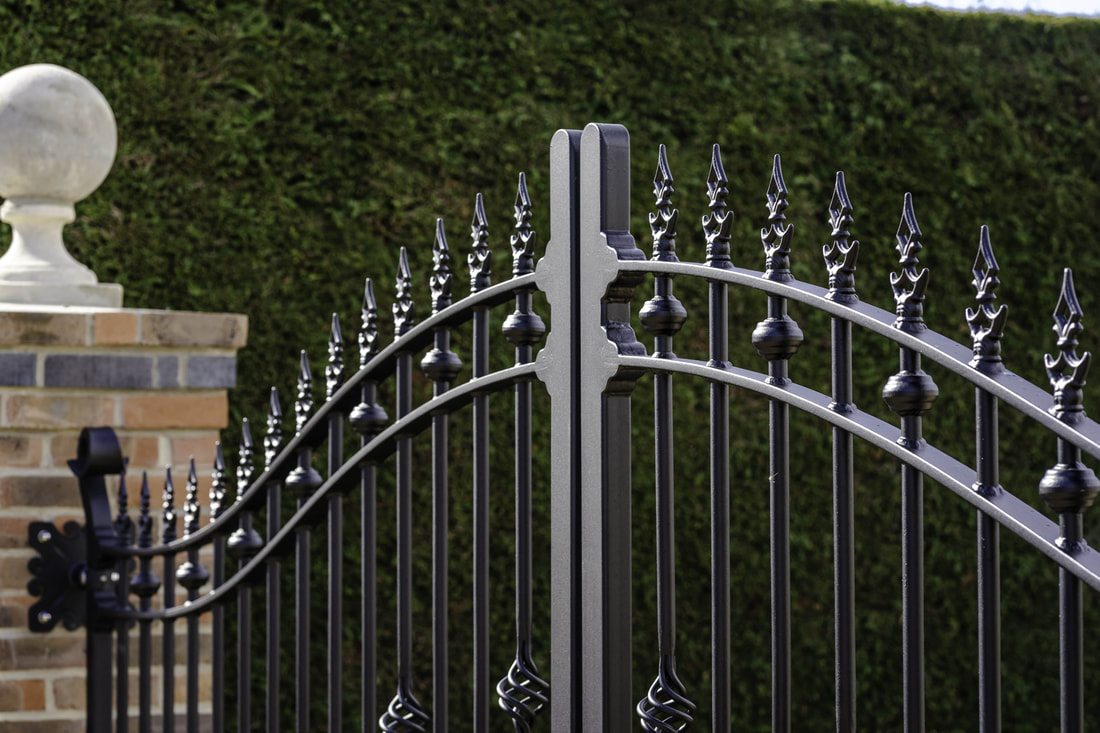 Quality ironwork detail on electric entrance gates installed by Karlis